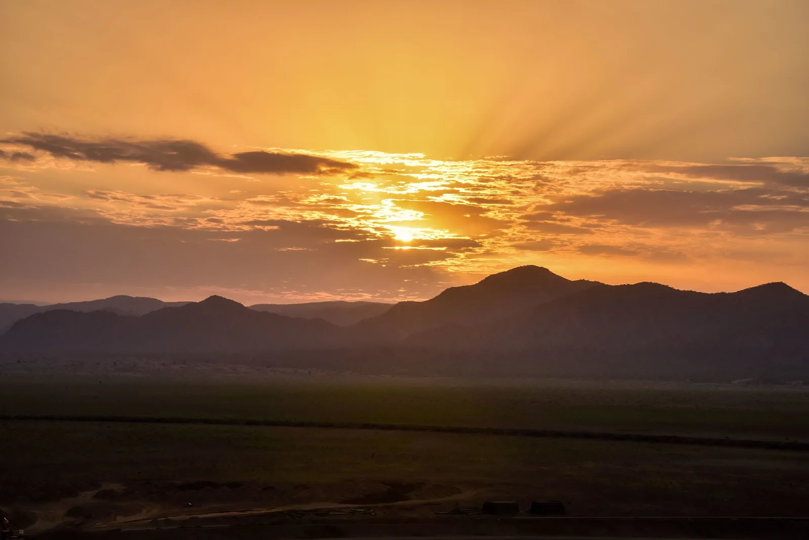 Sunrise across the open landscape of Ethiopia's Omo Valley